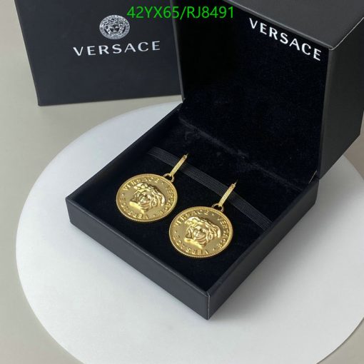 Versace gold medallion earrings in box.