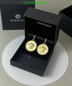 Versace gold medallion earrings in black box.