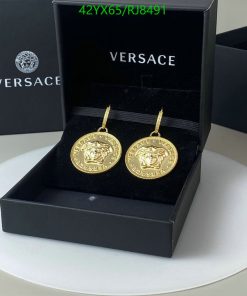 Gold medallion earrings in Versace box.