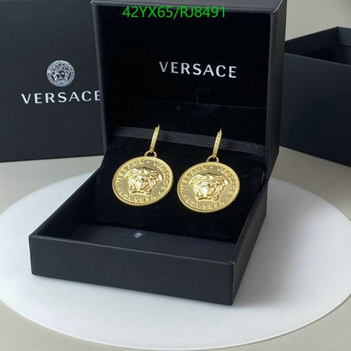 Gold medallion earrings in Versace box.