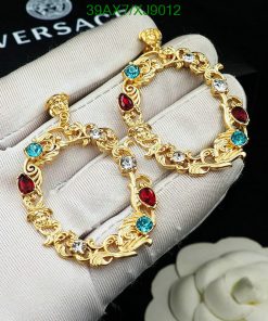 Gold bracelet with red and blue gems.