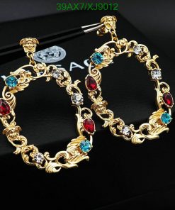 Gold hoop earrings with red and blue gemstones.