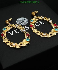 Gold Versace style bracelet with colored gems.