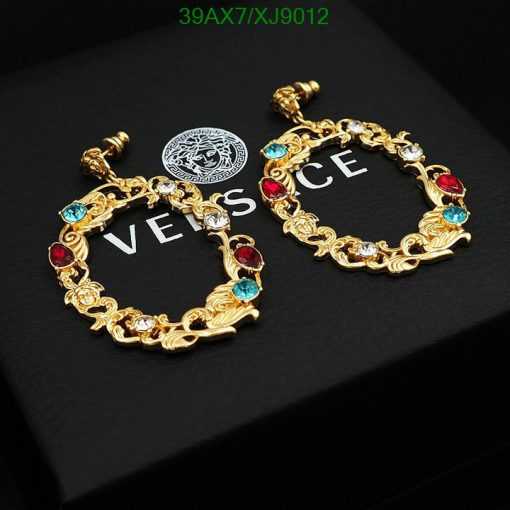 Gold Versace style bracelet with colored gems.