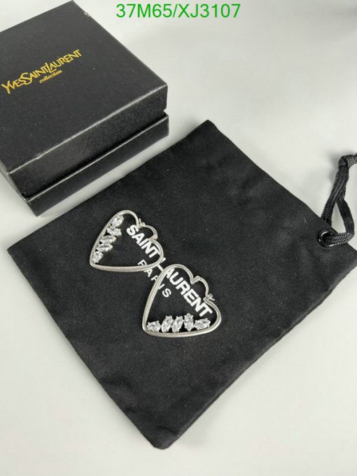 Designer heart-shaped earrings with branded box and pouch.