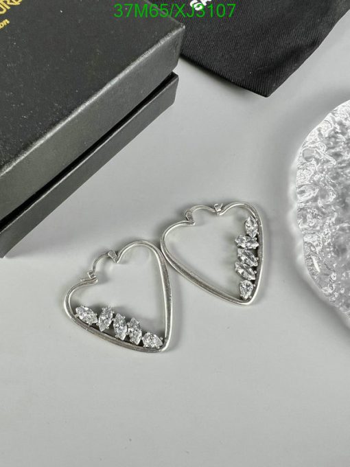 Heart-shaped silver earrings with crystals.