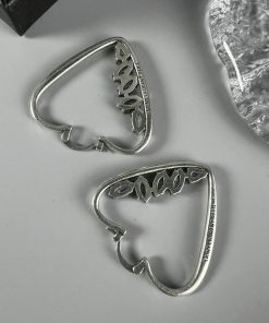 Silver guitar pick-shaped earrings.