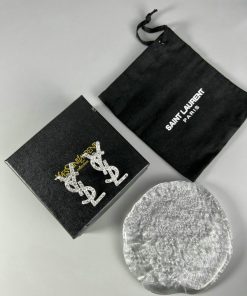 Saint Laurent earrings packaging and brand pouch.