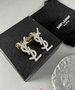 Saint Laurent logo earrings on black packaging