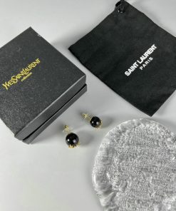 Black earrings, branded box and pouch, bubble wrap.