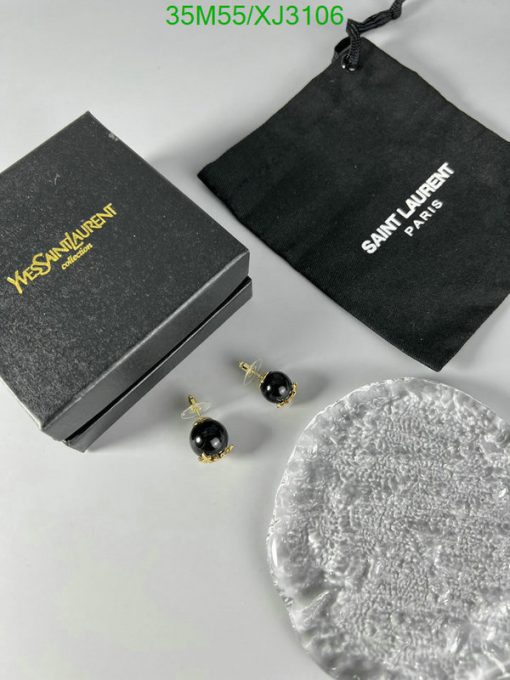 Black earrings, branded box and pouch, bubble wrap.