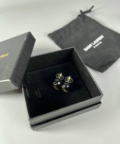 Saint Laurent earrings in open box with pouch.