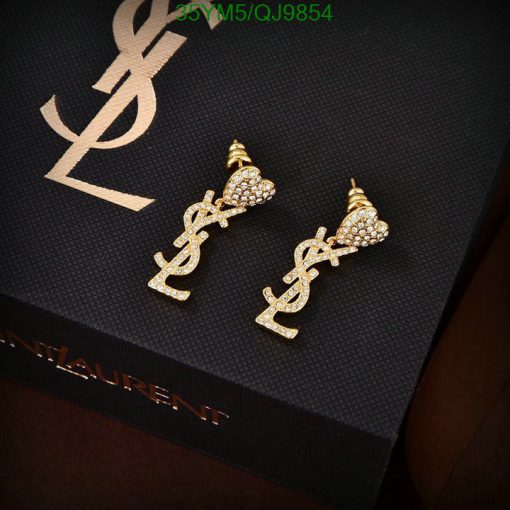 Gold designer logo earrings on branded box.