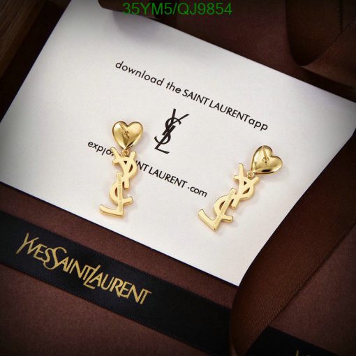 Gold designer logo earrings on branded card.