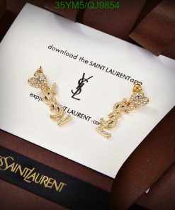 Saint Laurent gold earrings on branded card.