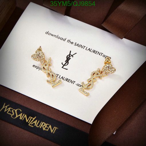 Saint Laurent gold earrings on branded card.