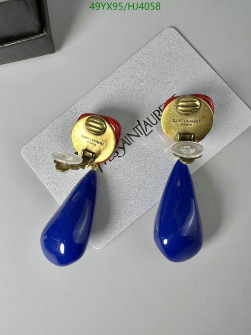 Blue teardrop earrings on branded card.