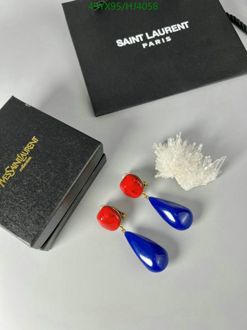 Red and blue Yves Saint Laurent earrings with boxes.