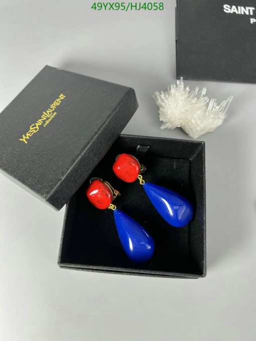 Red and blue earrings in black jewelry box.