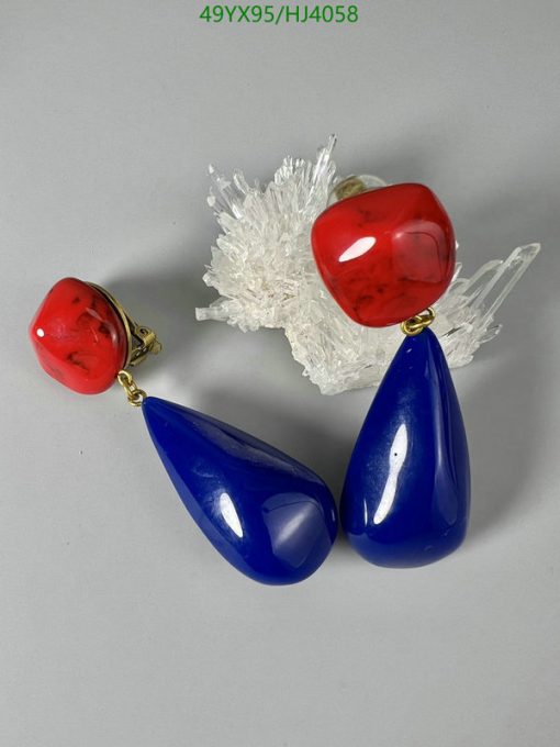 Red and blue drop earrings on white background.