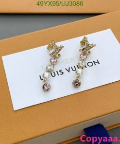 Louis Vuitton-style earrings on display card.