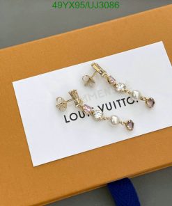 Luxury branded earrings on display packaging.