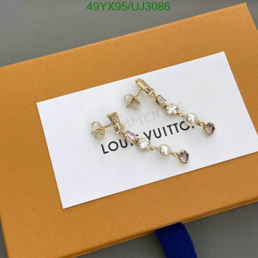 Luxury branded earrings on display packaging.