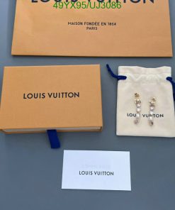 Louis Vuitton packaging and jewelry on display.