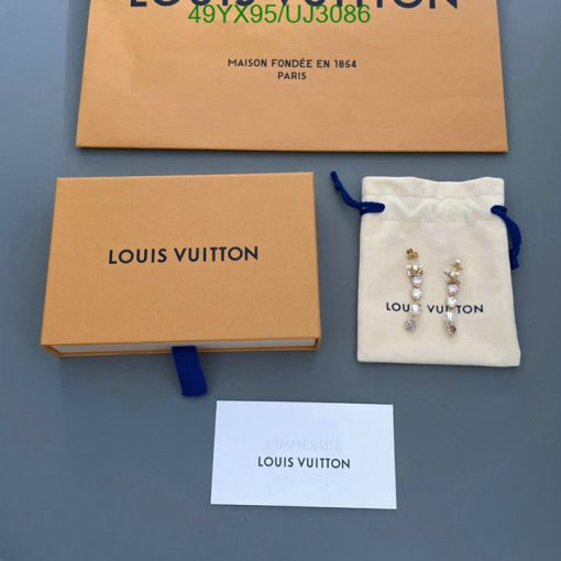 Louis Vuitton packaging and jewelry on display.