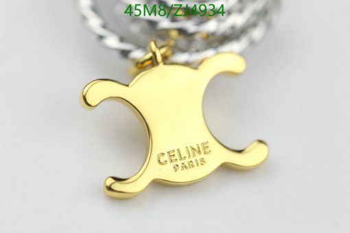 Gold designer logo keychain accessory.