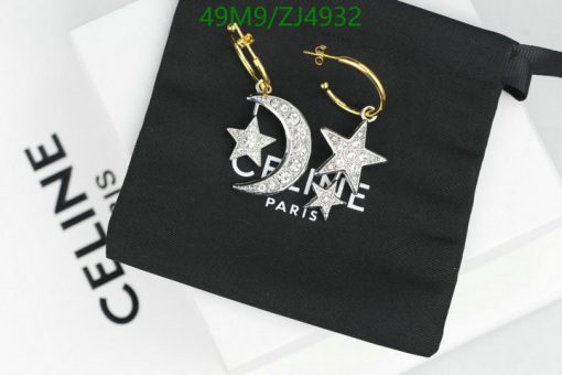 Designer star and moon earrings on branding pouch.