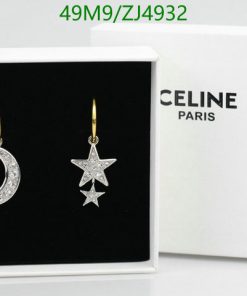 Celine star and moon earrings in box.