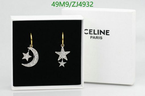 Celine star and moon earrings in box.