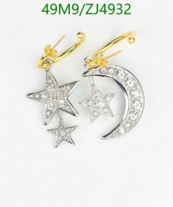 Star and moon diamond earrings on white background.