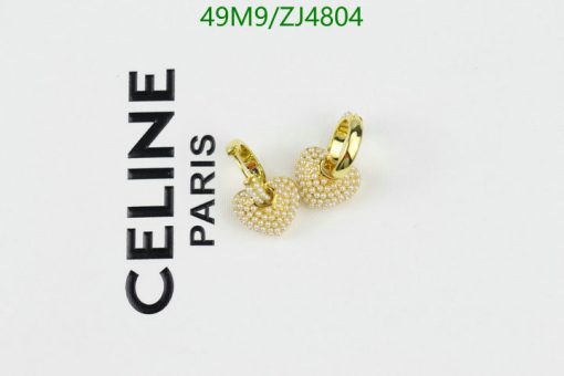 Gold hoop earrings with pearls beside "CELINE PARIS" logo.