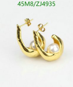 Gold pearl hoop earrings on white background.