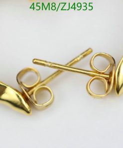 Gold metal collar tips and stick pins.