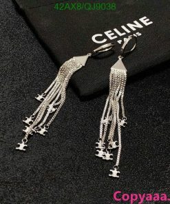 Silver tassel earrings on black Celine cloth.