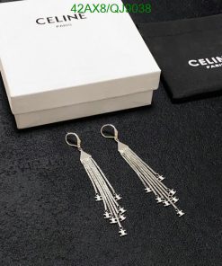 Celine tassel earrings with box and pouch on fabric.