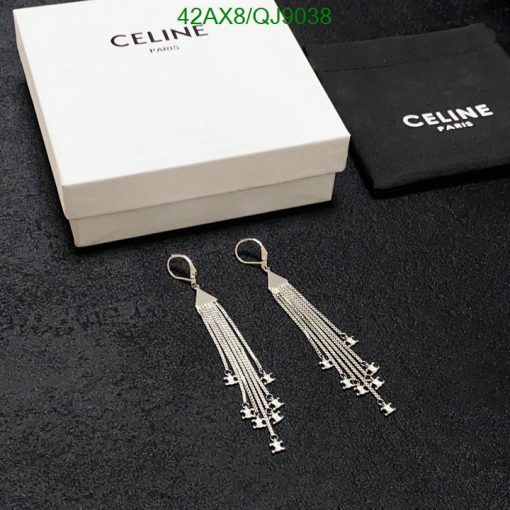 Celine tassel earrings with box and pouch on fabric.