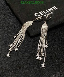 Silver tassel earrings on black Celine pouch.