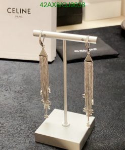 Silver tassel earrings on display stand.