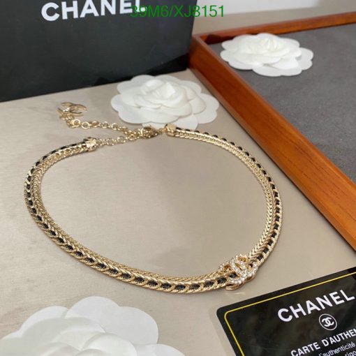 Gold chain necklace with authenticity certificate displayed.