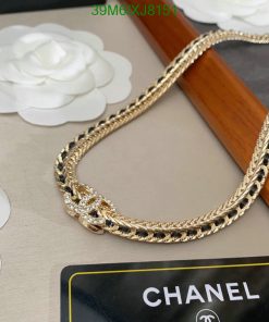 Gold chain necklace with diamonds on display.