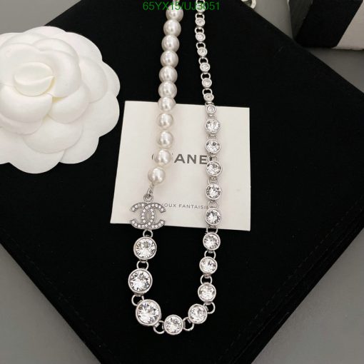 Elegant pearl and crystal necklace with logo pendant.