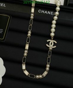 Chanel pearl necklace with logo pendant on display.