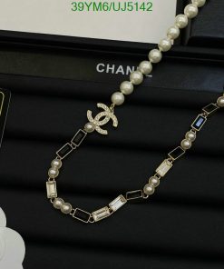 Pearl necklace with designer logo on display