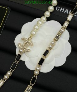 Pearl necklace with logo pendant on white flower.