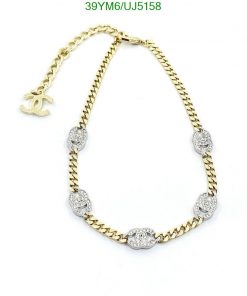 Gold chain necklace with diamond accents and logo charm.