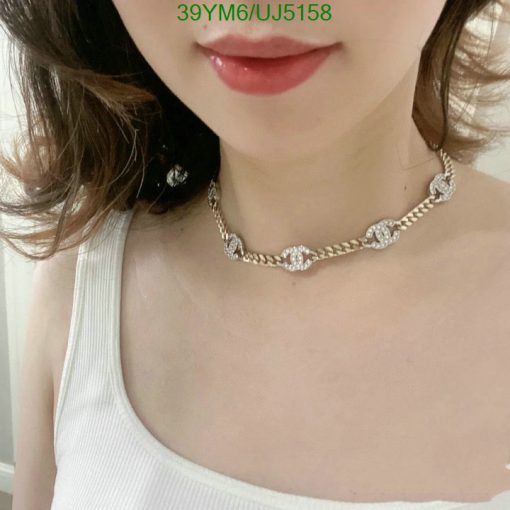 Woman wearing a diamond necklace.